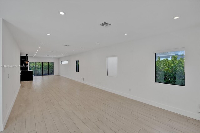 120 NW 41st St, Miami, FL 33127 - empty room with recessed lighting and light wood-style floors