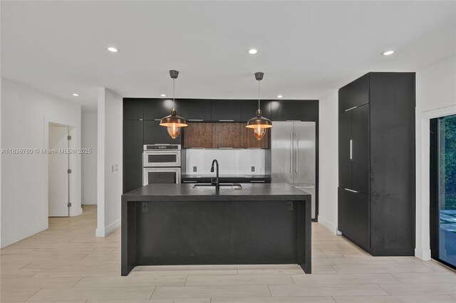 120 NW 41st St, Miami, FL 33127 - kitchen featuring modern cabinets, dark countertops, appliances with stainless steel finishes, recessed lighting, and decorative light fixtures