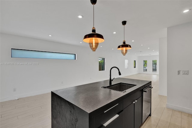 120 NW 41st St, Miami, FL 33127 - kitchen featuring dark cabinets, open floor plan, an island with sink, stainless steel dishwasher, and recessed lighting