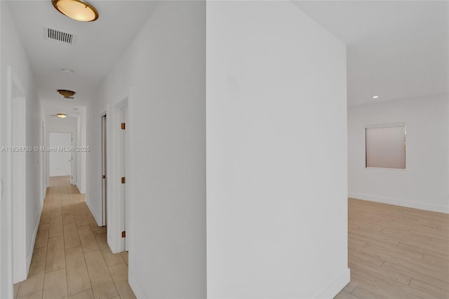 120 NW 41st St, Miami, FL 33127 - hall with light wood-style flooring and baseboards