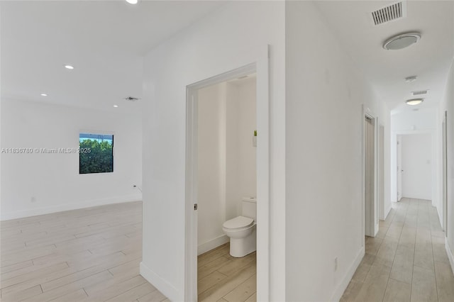 120 NW 41st St, Miami, FL 33127 - hallway with light wood-style floors and recessed lighting