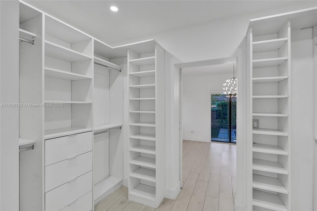 120 NW 41st St, Miami, FL 33127 - walk in closet featuring a chandelier and light wood-style flooring