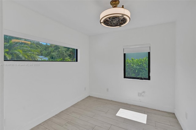 120 NW 41st St, Miami, FL 33127 - unfurnished room featuring wood finished floors and baseboards