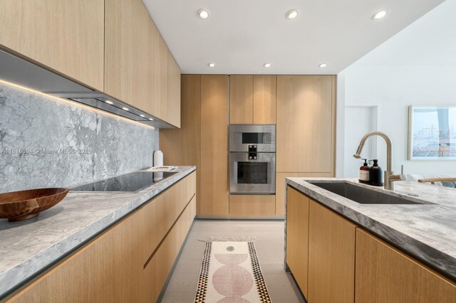500 Alton Rd Unit 4004, Miami Beach, FL 33139 - kitchen with stainless steel oven, black electric cooktop, recessed lighting, backsplash, and modern cabinets