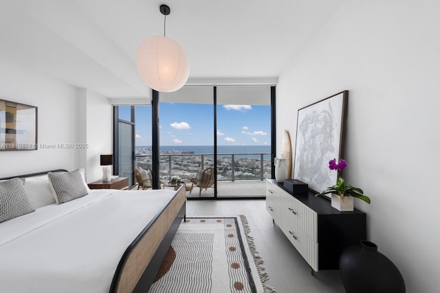 500 Alton Rd Unit 4004, Miami Beach, FL 33139 - bedroom featuring a wall of windows, multiple windows, and light tile patterned floors