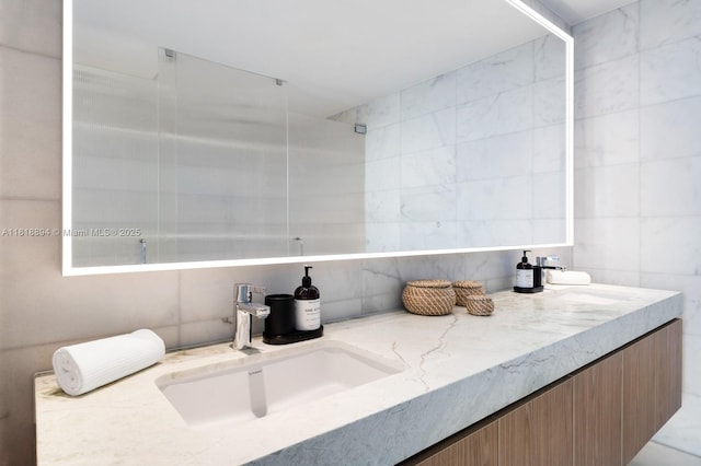 500 Alton Rd Unit 4004, Miami Beach, FL 33139 - full bathroom with double vanity and tile walls