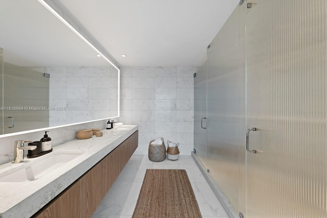 500 Alton Rd Unit 4004, Miami Beach, FL 33139 - bathroom featuring double vanity, a shower stall, and tile walls