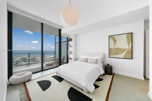 500 Alton Rd Unit 4004, Miami Beach, FL 33139 - bedroom featuring expansive windows, access to outside, and a water view