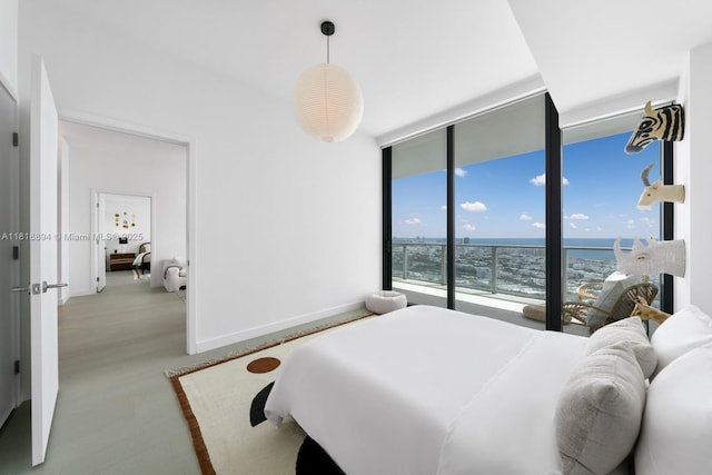 500 Alton Rd Unit 4004, Miami Beach, FL 33139 - bedroom featuring a wall of windows, wood finished floors, and a water view