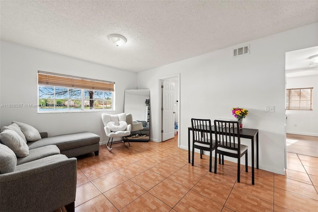 3660 N 56th Ave Unit 602, Hollywood, FL 33021 - living area featuring light tile patterned flooring and a textured ceiling