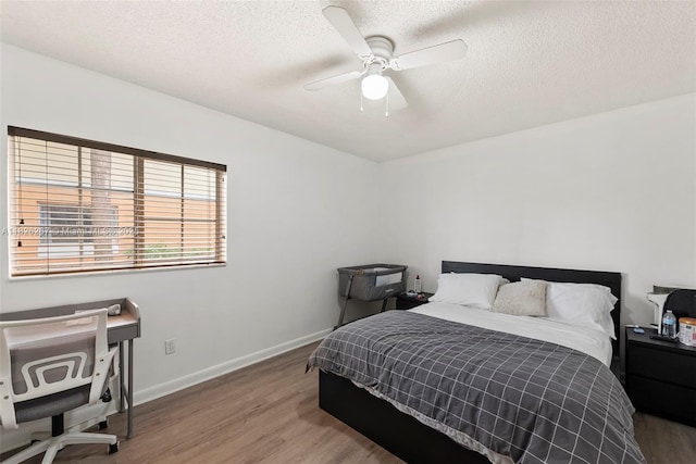 3660 N 56th Ave Unit 602, Hollywood, FL 33021 - bedroom featuring wood finished floors, a textured ceiling, and a ceiling fan