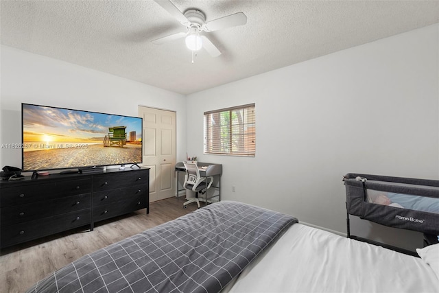 3660 N 56th Ave Unit 602, Hollywood, FL 33021 - bedroom with wood finished floors, a textured ceiling, and a ceiling fan