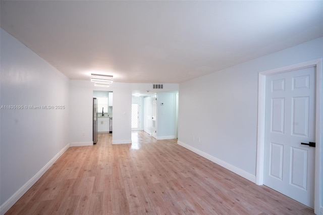 2780 N Pine Island Rd Unit 211, Sunrise, FL 33322 - unfurnished room featuring light wood-style flooring and baseboards
