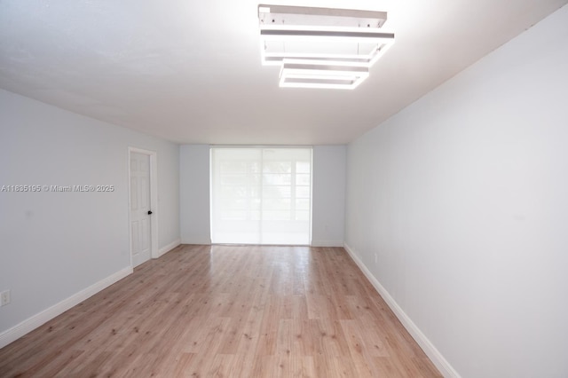 2780 N Pine Island Rd Unit 211, Sunrise, FL 33322 - unfurnished room with light wood-style flooring and baseboards