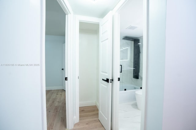 2780 N Pine Island Rd Unit 211, Sunrise, FL 33322 - hallway with baseboards and light wood-type flooring