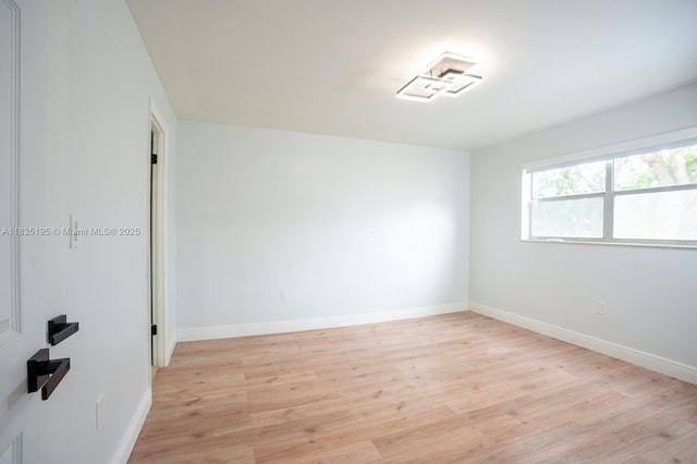 2780 N Pine Island Rd Unit 211, Sunrise, FL 33322 - empty room with light wood-style flooring and baseboards