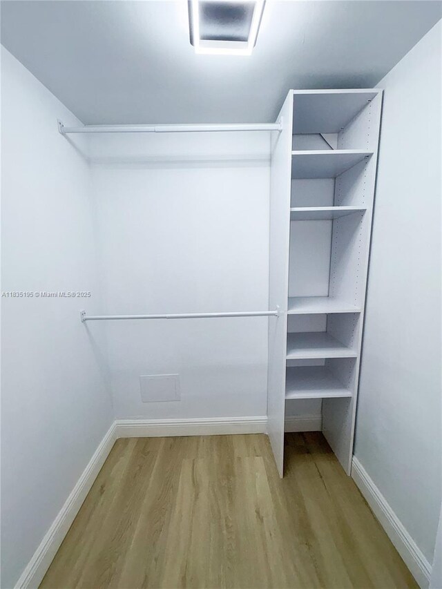2780 N Pine Island Rd Unit 211, Sunrise, FL 33322 - spacious closet with wood finished floors and attic access