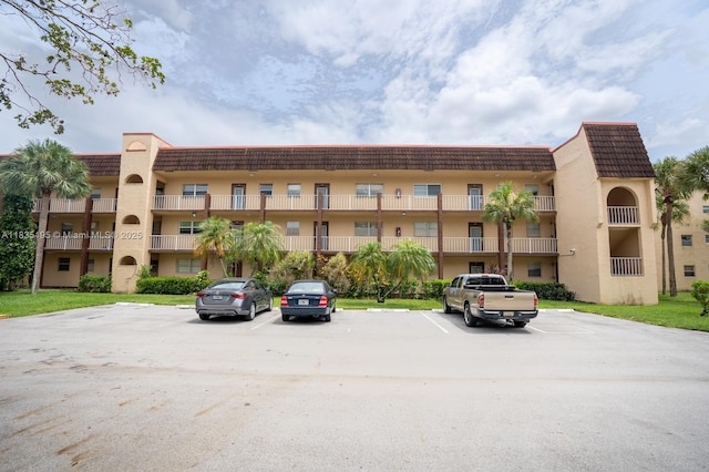 2780 N Pine Island Rd Unit 211, Sunrise, FL 33322 - view of apartment building / complex with uncovered parking