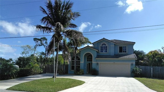 170 NE Dominican Ter, Port St Lucie, FL 34983 - mediterranean / spanish house with concrete driveway, stucco siding, a garage, and a tile roof