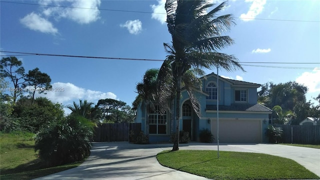 170 NE Dominican Ter, Port St Lucie, FL 34983 - view of front of property with driveway, stucco siding, an attached garage, and a tile roof