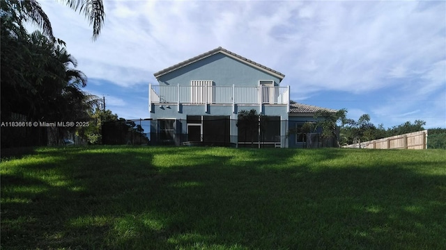 170 NE Dominican Ter, Port St Lucie, FL 34983 - back of property featuring a balcony, stucco siding, and a tiled roof