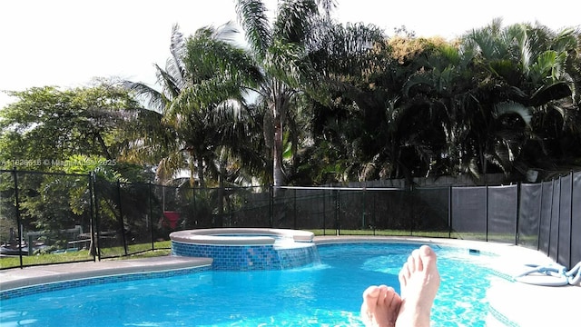 170 NE Dominican Ter, Port St Lucie, FL 34983 - view of swimming pool with a pool with connected hot tub