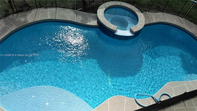 170 NE Dominican Ter, Port St Lucie, FL 34983 - view of pool featuring a pool with connected hot tub and a lanai