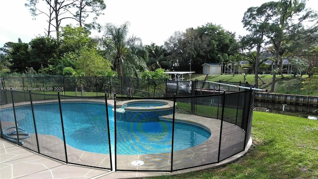 170 NE Dominican Ter, Port St Lucie, FL 34983 - view of swimming pool with a pool with connected hot tub and a shed