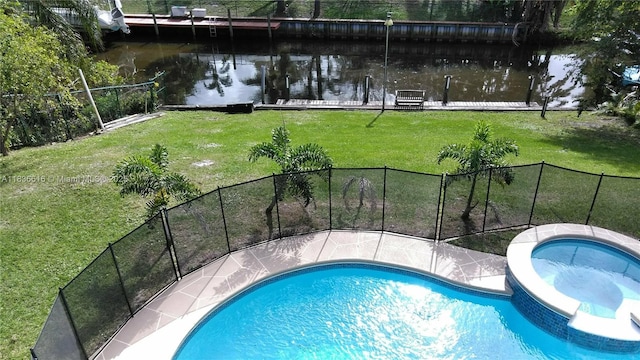 170 NE Dominican Ter, Port St Lucie, FL 34983 - view of swimming pool featuring a water view and a pool with connected hot tub