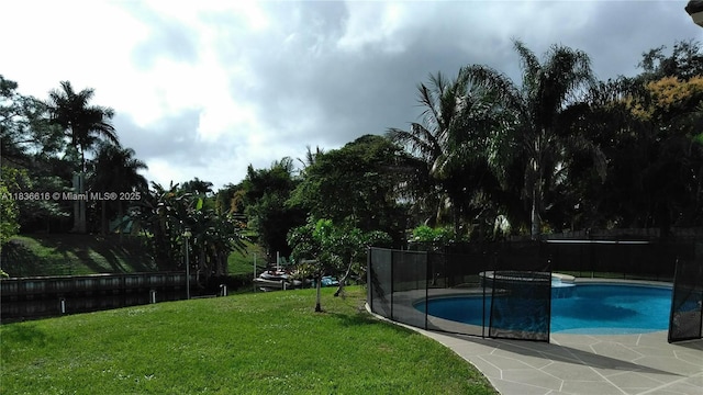 170 NE Dominican Ter, Port St Lucie, FL 34983 - view of swimming pool featuring a patio