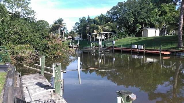 170 NE Dominican Ter, Port St Lucie, FL 34983 - dock area featuring a water view and view of scattered trees
