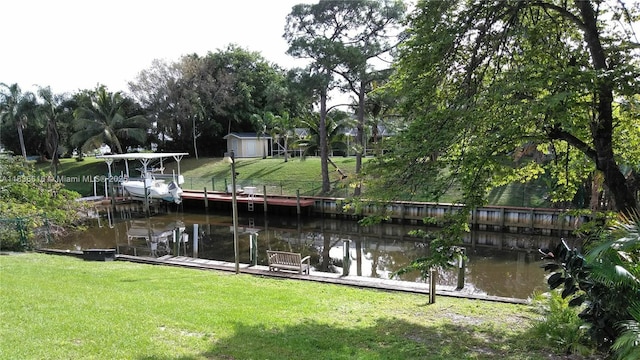 170 NE Dominican Ter, Port St Lucie, FL 34983 - dock area featuring a lawn and a water view