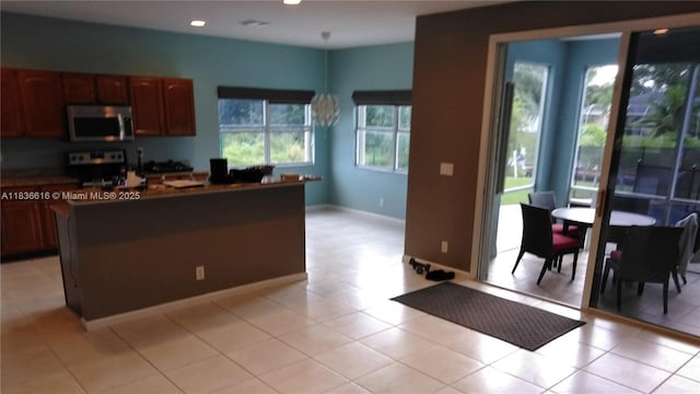 170 NE Dominican Ter, Port St Lucie, FL 34983 - kitchen with stainless steel appliances, dark countertops, and recessed lighting