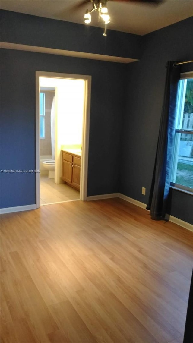 170 NE Dominican Ter, Port St Lucie, FL 34983 - spare room with light wood finished floors and baseboards