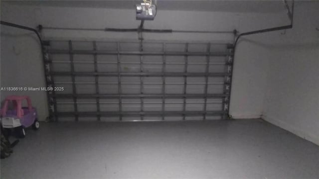 170 NE Dominican Ter, Port St Lucie, FL 34983 - garage featuring a garage door opener