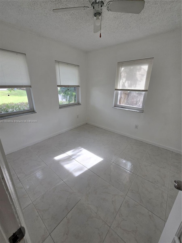 13567 SW 286th Ter, Homestead, FL 33033 - spare room with a textured ceiling and ceiling fan