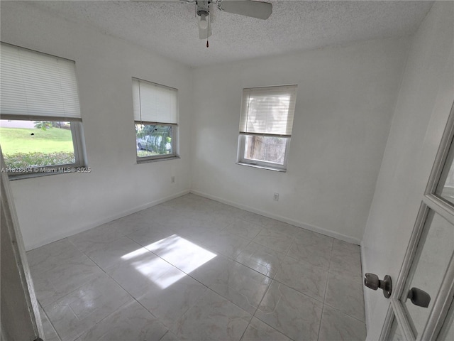 13567 SW 286th Ter, Homestead, FL 33033 - unfurnished room with healthy amount of natural light, a textured ceiling, and a ceiling fan