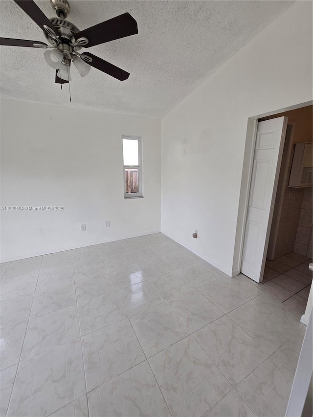 13567 SW 286th Ter, Homestead, FL 33033 - spare room with a textured ceiling and ceiling fan