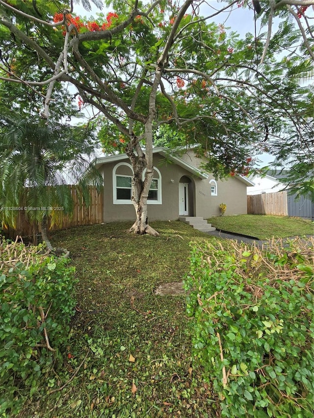 13567 SW 286th Ter, Homestead, FL 33033 - rear view of property featuring stucco siding