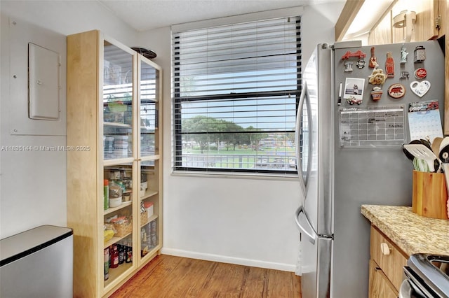 1532 Whitehall Dr Unit 202, Davie, FL 33324 - kitchen with appliances with stainless steel finishes, light wood finished floors, light countertops, and electric panel
