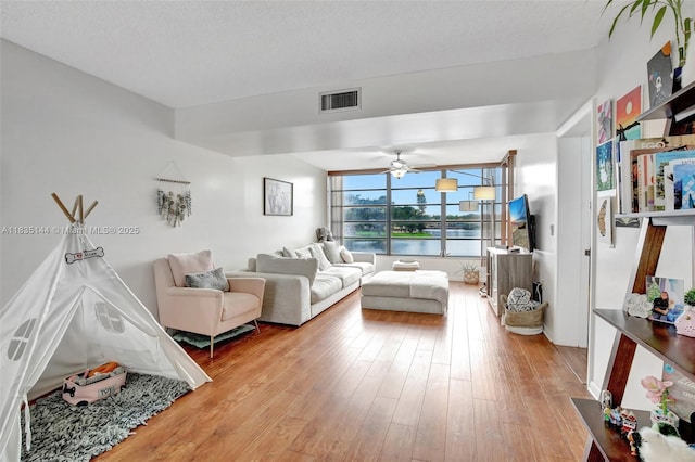 1532 Whitehall Dr Unit 202, Davie, FL 33324 - living room with light wood finished floors and a ceiling fan