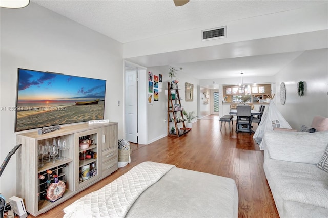1532 Whitehall Dr Unit 202, Davie, FL 33324 - living room featuring wood finished floors and a textured ceiling