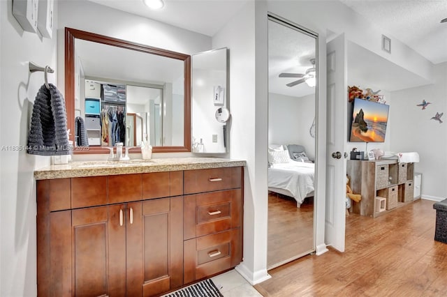 1532 Whitehall Dr Unit 202, Davie, FL 33324 - full bathroom with ensuite bath, vanity, ceiling fan, and wood finished floors