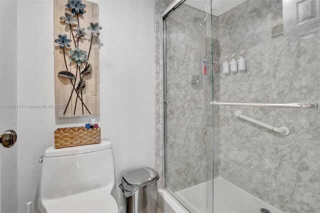1532 Whitehall Dr Unit 202, Davie, FL 33324 - bathroom featuring toilet and an enclosed shower