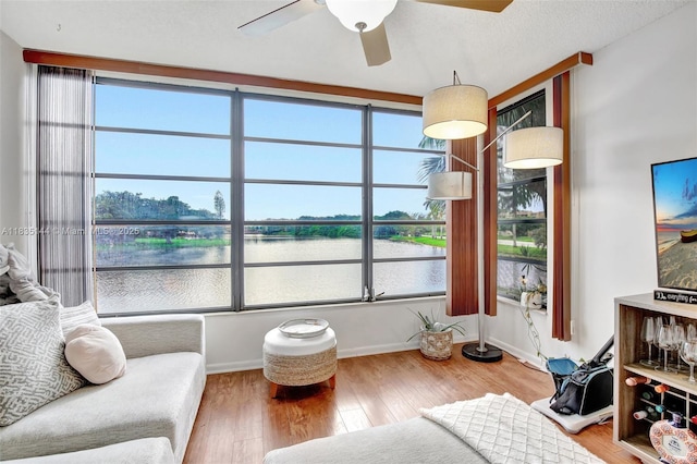 1532 Whitehall Dr Unit 202, Davie, FL 33324 - living area with a ceiling fan and wood finished floors