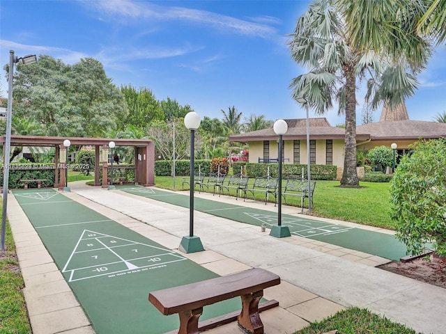 4805 NW 35th St Unit 603, Lauderdale Lakes, FL 33319 - view of home's community featuring a lawn and shuffleboard