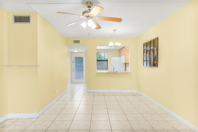 10332 Sunrise Lakes Blvd Unit 206, Sunrise, FL 33322 - spare room featuring a chandelier, ceiling fan, and light tile patterned floors