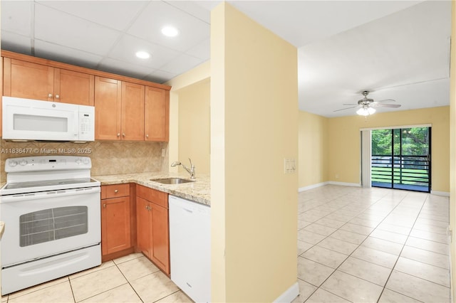 10332 Sunrise Lakes Blvd Unit 206, Sunrise, FL 33322 - kitchen with white appliances, light tile patterned flooring, light stone counters, ceiling fan, and open floor plan