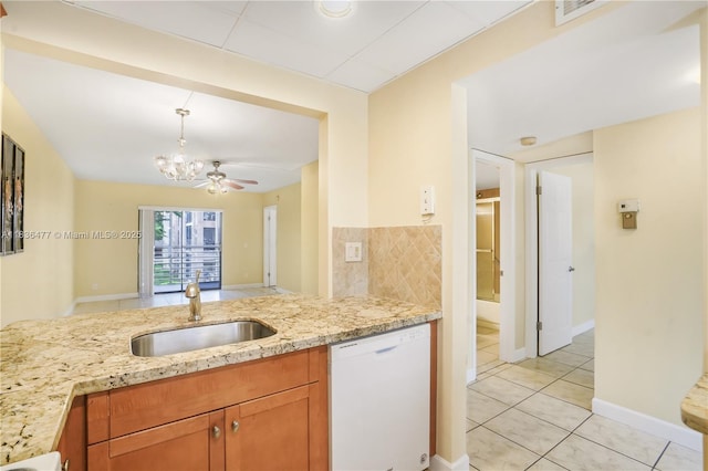 10332 Sunrise Lakes Blvd Unit 206, Sunrise, FL 33322 - kitchen featuring dishwasher, light stone counters, a chandelier, light tile patterned floors, and brown cabinetry
