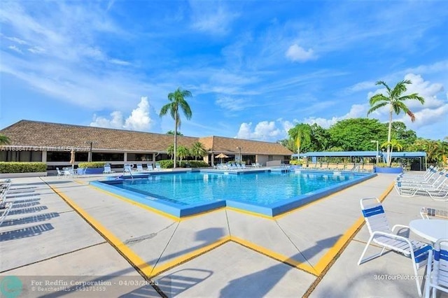 10332 Sunrise Lakes Blvd Unit 206, Sunrise, FL 33322 - community pool with a patio